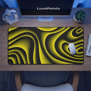 May include: A black and yellow abstract design mousepad with the text "LumiPoints" on the monitor. The mousepad has a wavy pattern with a white mouse on top. A pair of white headphones and a small succulent plant are also visible.