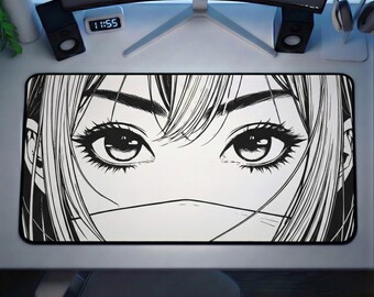 May include: Black and white desk mat featuring a manga-style illustration of a person's eyes and face. The design is detailed with bold lines and shading, creating a striking visual. The mat is rectangular and designed to protect a desk surface.