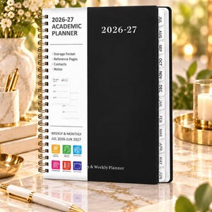 May include: A black and white 2026-27 academic planner with a spiral binding. The cover features the text 2026-27 ACADEMIC PLANNER, lists features like storage pocket and reference pages, and includes monthly tabs from July to June for weekly planning.