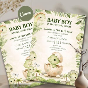 May include: Two baby shower invitations with a dinosaur theme. The invitations feature the text "Baby Boy is Hatching Soon" and include event details. The design incorporates watercolour illustrations of baby dinosaurs, eggs, and foliage in soft green and beige tones.
