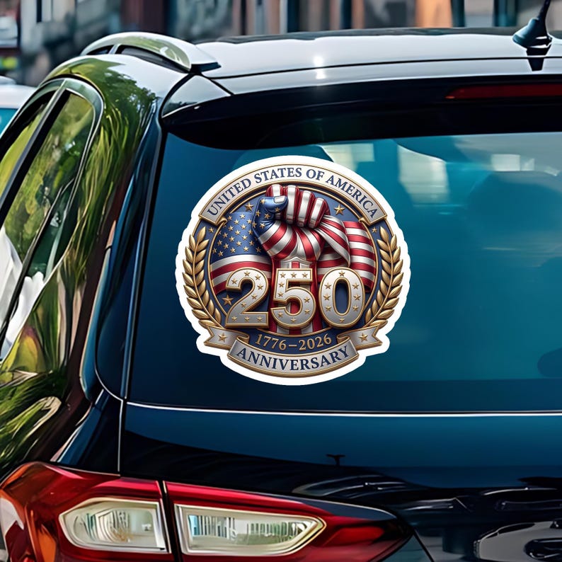 May include: A circular sticker commemorating the 250th anniversary of the United States of America. The design features the American flag, a clenched fist, and the text "250 1776-2026 Anniversary" in a gold and blue color scheme.