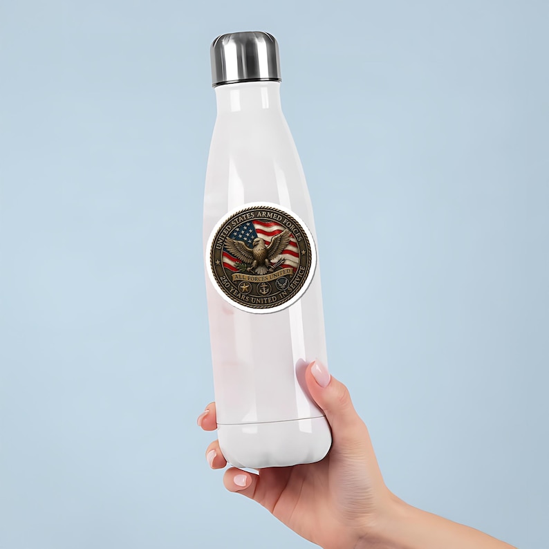 May include: White insulated water bottle with a silver cap. A round sticker on the bottle features an eagle, American flag, and text that reads "United States Armed Forces" and "250 Years United in Service."