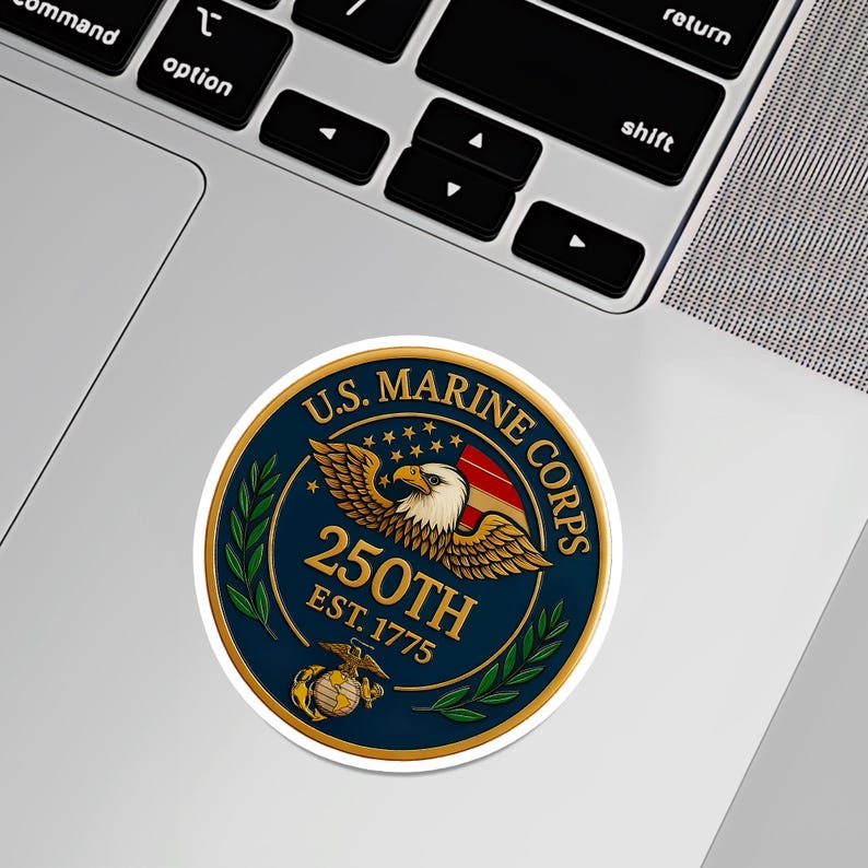 May include: A round sticker featuring the U.S. Marine Corps emblem. The design includes a bald eagle, American flag, and the text "250th EST. 1775" in gold lettering on a navy blue background, with a gold border.