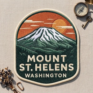 May include: An embroidered patch featuring a landscape of Mount St. Helens in Washington. The design shows a snow-capped mountain peak, a dark green forest, and an orange sky with a sun and clouds. The text reads MOUNT ST. HELENS WASHINGTON.