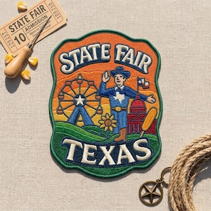 May include: An embroidered patch featuring the text STATE FAIR TEXAS, a Ferris wheel, a person in a cowboy hat, a sunflower, a corn dog, and a building. The patch is surrounded by a state fair admission ticket and a metal star keychain.