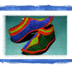 May include: Two knitted shoes with a red, green, and blue pattern. The shoes are made of a soft, textured yarn.