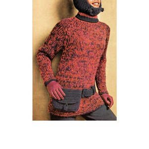 Puede incluir: Un conjunto de punto vintage en tonos rojo y negro, con un jersey de cuello alto, capucha a juego y riñonera. El conjunto incluye guantes rosas. El jersey y la capucha están hechos de un hilo grueso y texturizado.