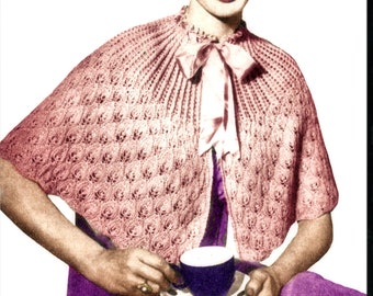 May include: A woman wearing a pink crocheted cape with a white bow and a purple dress, holding a blue teacup and saucer.