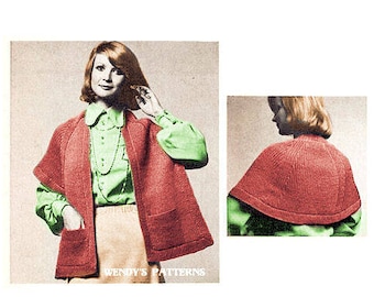 May include: A red knitted cape with a collar and long sleeves. The cape is shown on a model wearing a green blouse and a brown skirt. The image includes the text "Wendy's Patterns".