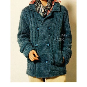 May include: A teal blue knitted cardigan with a double breasted closure and four blue buttons. The cardigan has a large collar and two pockets. The model is wearing a patterned scarf and a plaid shirt underneath the cardigan.