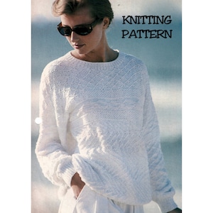 May include: A white knitted jumper with a lacy pattern. The jumper has a round neckline and long sleeves. The text "Knitting Pattern" is printed at the top of the image.