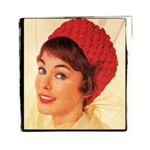 May include: A woman wearing a red crocheted hat. The hat is a close-fitting style with a rounded crown and a wide brim.