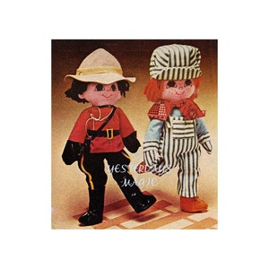 Peut inclure: Deux poupées en tissu faites à la main, l'une habillée en gendarme canadien avec une veste rouge, un pantalon noir et un chapeau brun, et l'autre habillée en chef de train avec une chemise à rayures bleues et blanches, une salopette bleue et un chapeau à rayures bleues et blanches.