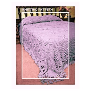 May include: A lavender knitted bedspread with a floral and geometric pattern, fringed edges, and the text "KNITTING PATTERN" at the top. The bedspread is draped over a bed with a dark wooden headboard.