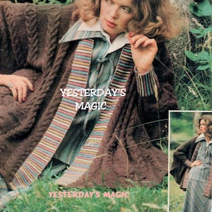 May include: A brown knitted cardigan with a colorful striped trim. The cardigan is open in the front and has a relaxed fit. The model is wearing the cardigan over a striped shirt and a skirt. The image includes the text "Yesterday's Magic".