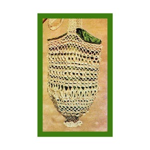 May include: A crocheted bag with a green lining. The bag is made with white yarn and has a fringed bottom.
