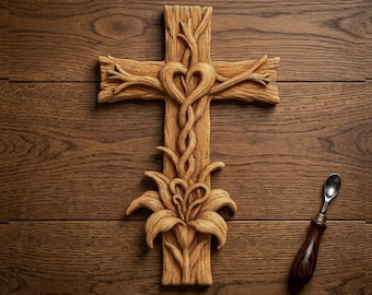 May include: A wooden cross with a heart-shaped design at the center, with the text "CNC & 3D PRINT READY" at the top and "Sacred Heart Cross 3D STL" at the bottom. The cross is made of light brown wood and has a detailed, carved appearance.