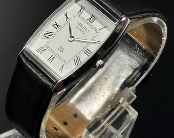Vintage Seiko slim tank Wristwatch: Quartz battery, Roman Dial, leather watch, japan made