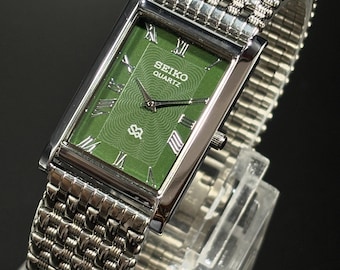 Reloj de pulsera Seiko Slim Tank vintage: pila de cuarzo, esfera verde con números romanos