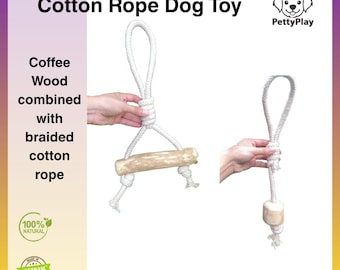 May include: A white cotton rope dog toy with a coffee wood accent. The toy is made of braided cotton rope and features the text "Cotton Rope Dog Toy". The toy is labeled as 100% natural.
