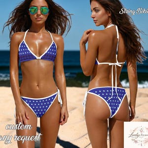 May include: A blue and white polka dot string bikini. The bikini top and bottom are trimmed with white and have a tie closure. The words "String Bikini" are in the upper right corner.