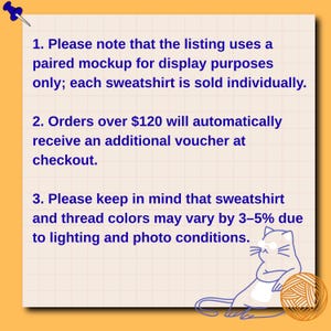 May include: A cream-colored paper with text about sweatshirt listings, including a note about paired mockups, vouchers for orders over $120, and color variations. A blue pushpin and a cartoon cat with yarn are also visible.