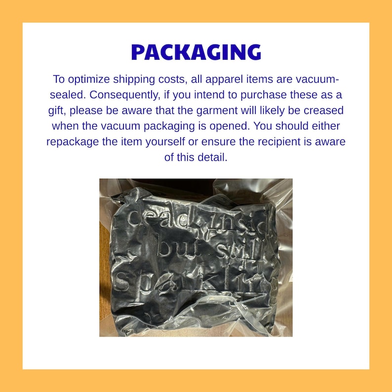 May include: A black garment vacuum-sealed in clear plastic packaging. The text "dead inside but still sparkling" is embroidered or printed on the fabric, which appears creased due to the vacuum compression process used for shipping.