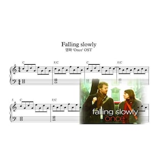 May include: Musical score for "Falling Slowly" with the film poster for "Once". The poster shows a man and woman. The title "Falling Slowly" is at the top, with the film title "Once" below. The text "Once" is in a green font.