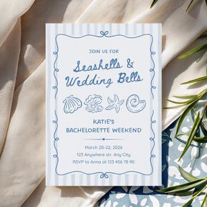 May include: A white ceramic mug with a black handle and the text "But First, Coffee" in a bold, black font. The mug is set against a blurred background, suggesting a cozy setting.