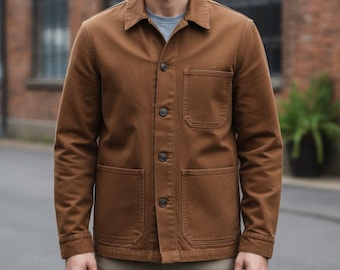 A men's casual workwear jacket, medium brown or tan in color, made from a textured fabric like corduroy or heavy cotton canvas.