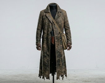 May include: A long, distressed brown leather coat with a double-breasted design. The coat features a wide collar, a shoulder bag, and tattered edges. The coat is displayed on a mannequin against a white background.