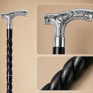 Op de afbeelding: Een wandelstok met een zwarte houten schacht met een opvallend gedraaid spiraalontwerp. Het handvat is gemaakt van gepolijst zilverkleurig metaal met een ingewikkeld, in reli&euml;f gemaakt bloemmotief en een gladde, ronde T-vormige greep.