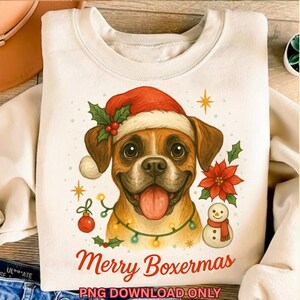 May include: Cream-colored sweatshirt featuring a Boxer dog wearing a Santa hat, with the text "Merry Boxermas." The design includes Christmas ornaments, holly, a poinsettia, and a snowman. "PNG DOWNLOAD ONLY" is printed at the bottom.
