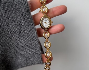 Vintage gouden dameshorloge met parels | Verstelbare armband | Cadeaubox inbegrepen