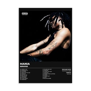 May include: A black and white poster featuring the album "MANIA" by SOFAYGO. The poster includes a photo of a person with dreadlocks and tattoos. The tracklist and release information are also displayed.