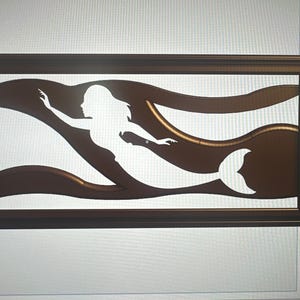 May include: A framed wall art piece featuring a white silhouette of a mermaid swimming through brown wavy lines. The mermaid is depicted with flowing hair and a fishtail. The frame is a dark brown color.
