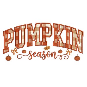 May include: An embroidery design featuring the word PUMPKIN in large, orange and white gingham block letters, with the word season in orange cursive script below, accented by small orange pumpkins, bows, and a single oak leaf.