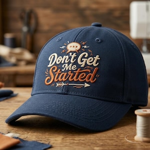 May include: A navy blue baseball cap featuring embroidered text that reads Don't Get Me Started in cream and orange thread. The design includes a small speech bubble icon above the text and a horizontal arrow graphic pointing to the right.