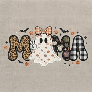 May include: A graphic design featuring the word MAMA with a ghost replacing the letter A. The first M has a leopard print, the ghost wears an orange plaid bow and makes a peace sign, and the final A has a black and white buffalo check pattern.