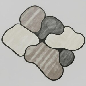 May include: Abstract drawing featuring organic shapes in shades of gray, beige, and brown, outlined in black. The shapes are clustered together on a white background, creating a modern, artistic design.