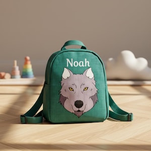 May include: A green backpack with the name "Noah" printed in white. The backpack features a wolf graphic with gray fur and yellow eyes. The bag has adjustable straps and a top handle.