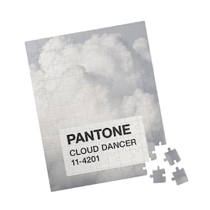 May include: A set of three ceramic mugs with a speckled, matte finish. The mugs are in shades of cream, light gray, and dark gray. Each mug has a simple, minimalist design, perfect for coffee or tea.