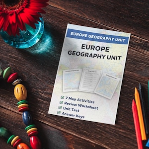 May include: A still-life arrangement featuring a red gerbera daisy in a blue glass vase, a colorful beaded necklace, a geography unit booklet, and colored pencils. The booklet reads "Europe Geography Unit."