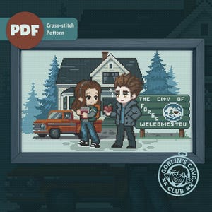 May include: A pixel art cross-stitch pattern featuring two characters standing in front of a house, an orange pickup truck, and a green sign that reads THE CITY OF FORKS WELCOMES YOU. The design includes blue pine trees and a red apple held by one character.