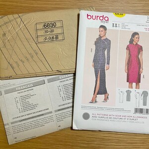 May include: A Burda Style sewing pattern packet, featuring a dress design. The packet includes pattern pieces, instructions in multiple languages, and images of the finished dresses. The pattern number is 6830, with sizes 10-20.