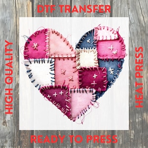May include: A heart-shaped DTF transfer design, ready to press. The design features a patchwork heart with various shades of pink, blue, and white fabric squares, stitched together with contrasting thread. The words "HIGH QUALITY", "DTF TRANSFER", "HEAT PRESS", and "READY TO PRESS" are printed in red.