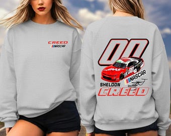 シェルドン・クリード #00 レーシングシャツ、NASCARドライバーTシャツ、モータースポーツTシャツ、スウェットシャツ、パーカーギフト