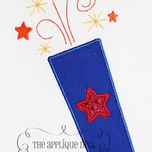 May include: Embroidered design of a blue firework with a red star on the side and red, orange, and yellow stars and swirls coming out of the top. The text "The Applique Diva" and "www.TheAppliqueDiva.com" is below the firework.