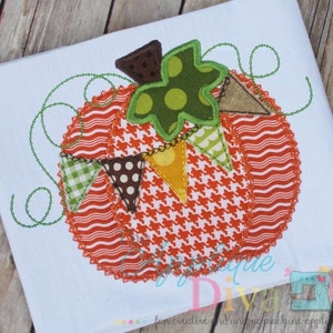 May include: A colorful patchwork pumpkin with a green leaf and a string of flags. The pumpkin is made of different fabrics, including orange, brown, white, and green.