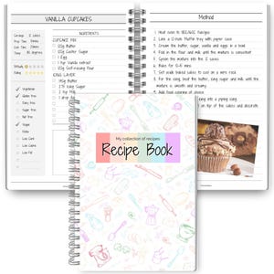 May include: A spiral-bound recipe book with a colorful cover that reads "Recipe Book." The open pages display a vanilla cupcake recipe with ingredients and instructions. The book is decorated with kitchen-themed doodles.